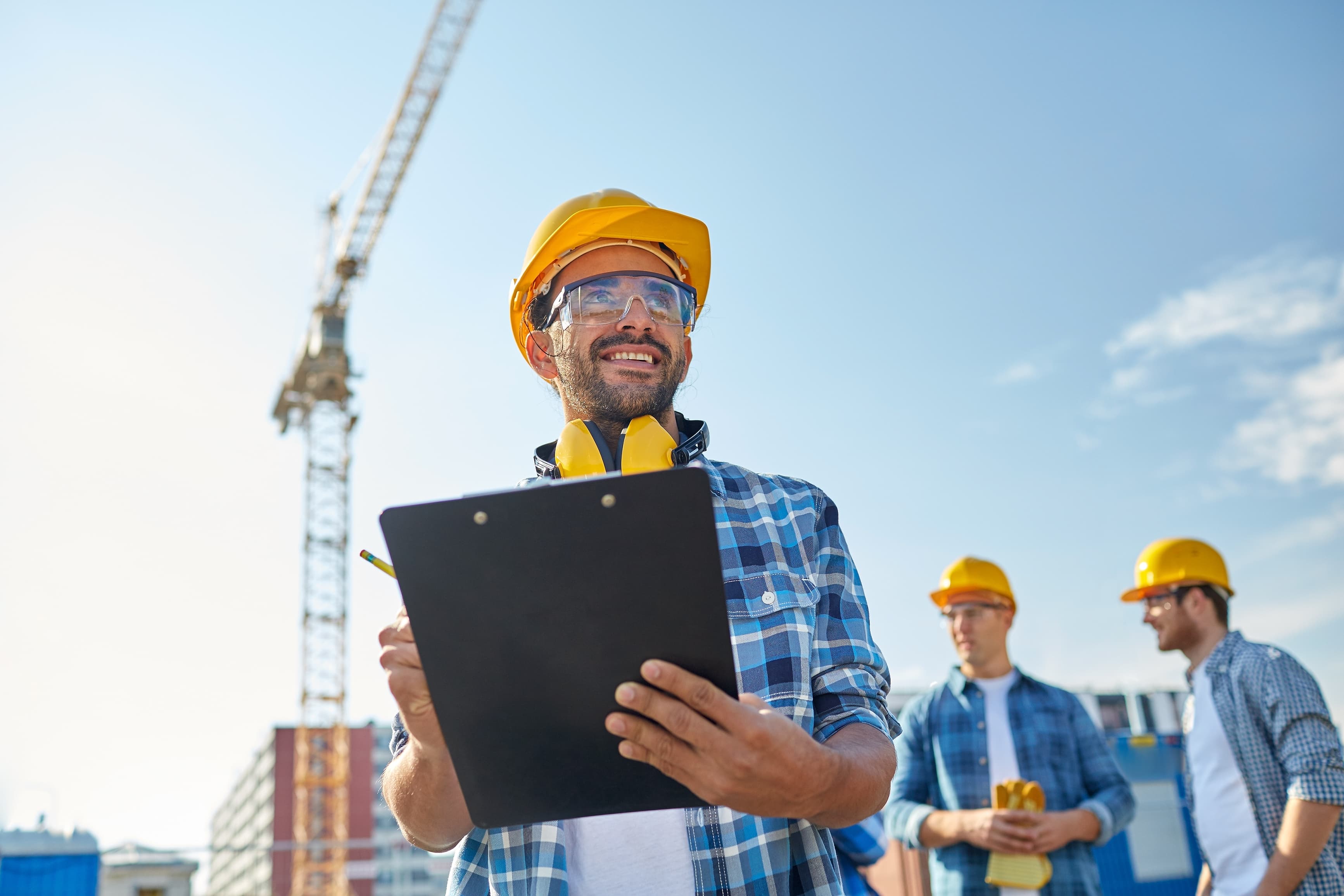 Aurora Home Hardware Pro contractor reviewing a clipboard on a jobsite