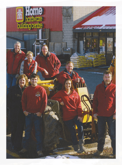 Aurora Home Hardware Building Centre staff team posing outside the store — three generations serving York Region since 1969