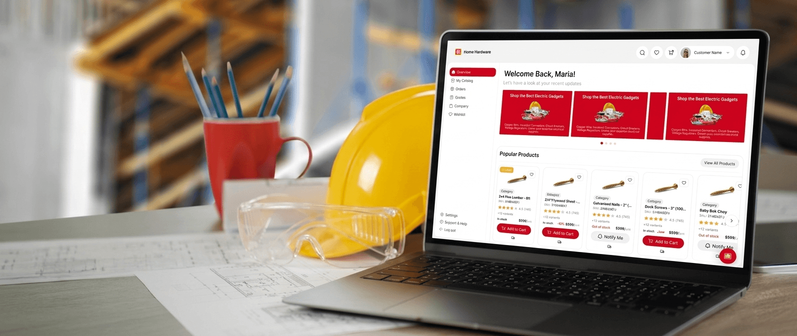 Laptop on a desk showing the PRO portal interface next to a yellow hard hat.