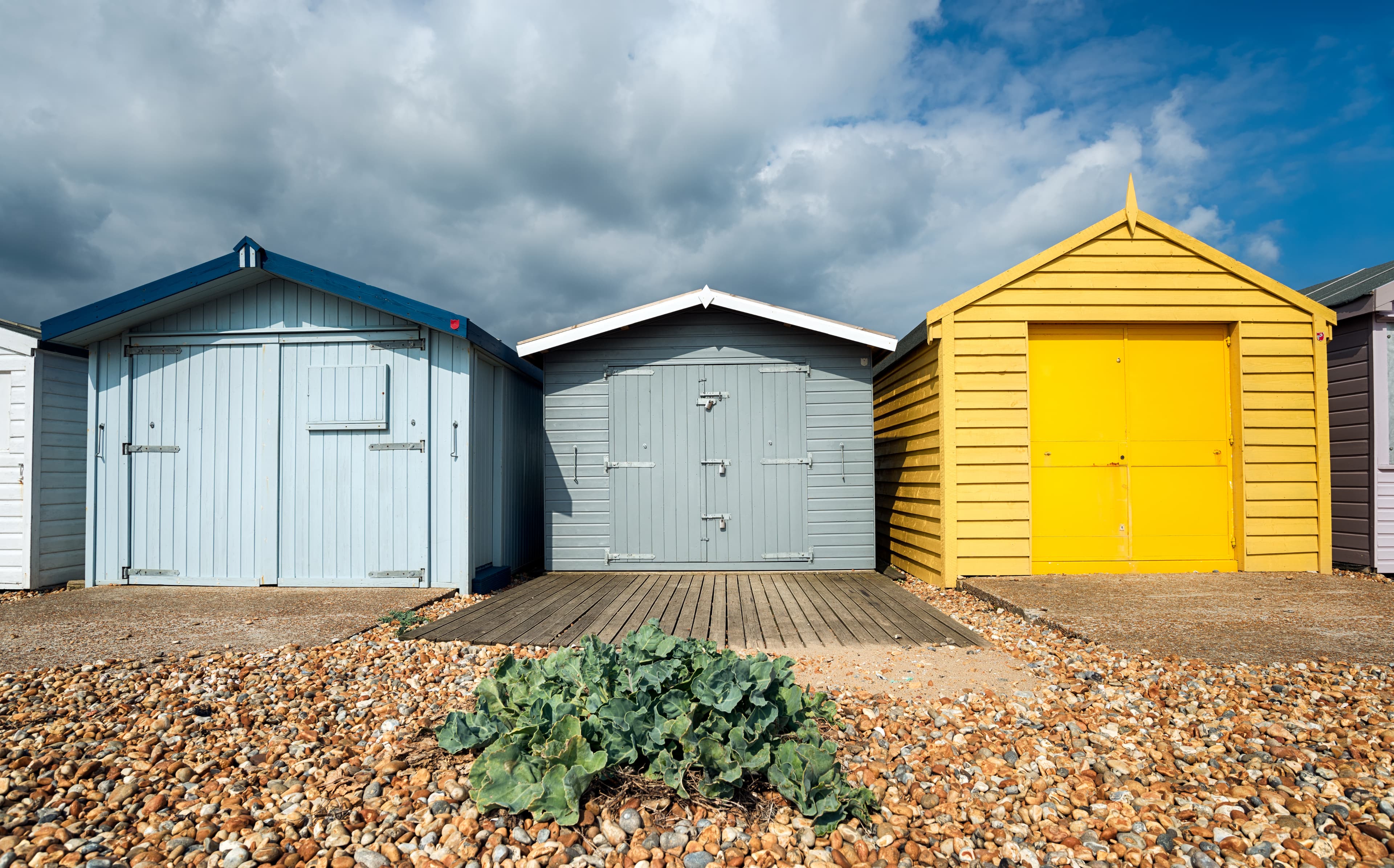 Colourful cottage-style buildings for the home, cottage, and garage build packages from Aurora Home Hardware.